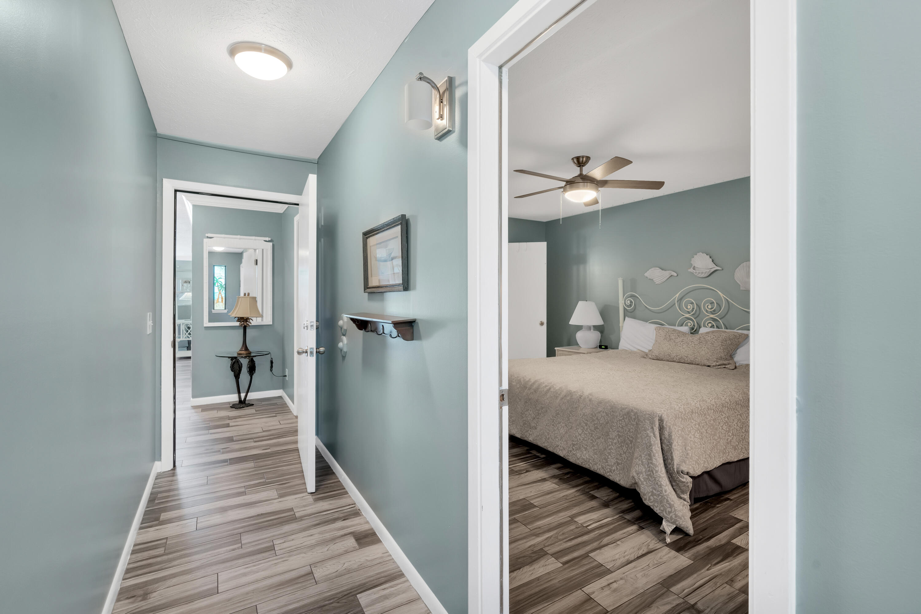 $5,000 CLOSING CREDIT!! Nearly $43K ACTUAL rental income in 2024! Discover your Gulf-Front Paradise in this spacious condo that SLEEPS 8! This 2 bedroom, 2 bath condo in Panama City Beach is the perfect beach retreat you've been dreaming of. Located in the low density, 30-unit complex of Whispering Seas, you'll be escaping the crowds! At a spacious 1,256 square feet, this condo is a great value compared to other properties in the area. It is impressively furnished to comfortably sleep 8 guests, making it an ideal vacation rental investment property. The layout and size of this condo rival that of a three-bedroom unit, providing plenty of space for everyone to relax and enjoy. NEW Refrigerator, hurricane resistant sliding doors and mattresses just replaced! The living room is a perfect place to unwind after a day in the sun and features breathtaking Gulf views and a sleeper sofa to accommodate guests. The two bedrooms are both generously sized with a king bed in the master suite and two queens in the second bedroom. You'll have stunning Gulf and palm tree views from the balcony! Whispering Seas offers amenities for both residents and guests to enjoy. Take a refreshing dip in the beachfront community pool, lounge in the sun or grill-out on the Gulf-Front Terrace. Don't miss out on this incredible opportunity to own a beachfront condo in Panama City Beach at a great value.