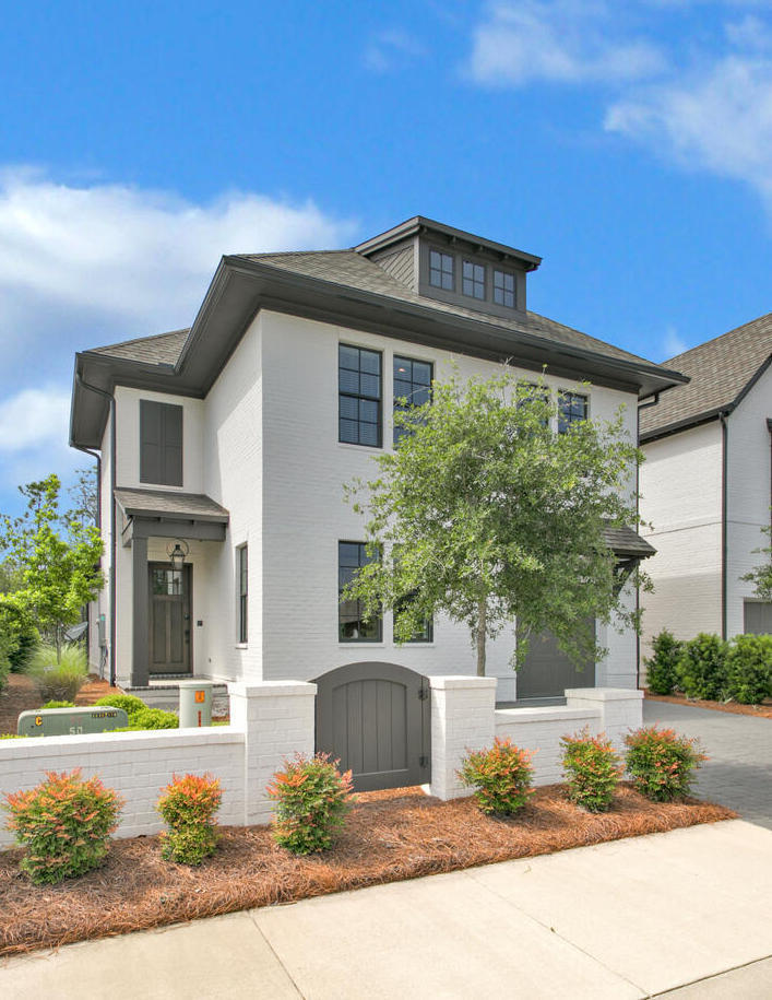 You won't find another like-new home offering the peaceful, gated privacy of the non-rental RidgeWalk community less than one mile from the beach! This beauty has it all - 1st Floor Master with shiplap walls, open concept Living/Dining/Kitchen ideal for entertaining, garage, screened porch, 1st Floor laundry, and a premium lot that backs up to wooded conservation area. Includes designer furnishings/art and all the essentials for relaxing and enjoying the 30A lifestyle - golf-cart, firepit, and Big Green Egg.  Plus the HOA maintains your yard and community pool is across the street. First floor features 10' ceilings, quartz countertops, engineered wood floors, plantation shutters, brick accent wall, wine refrigerator, double oven, farmhouse sink, and upgraded Bosch appliances. Call today!