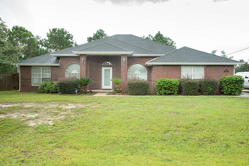New photos coming soon! Lovely 4 bedroom, 3 bathroom all brick home with side entry, oversized garage! All new paint and all new flooring! Huge living room with fireplace, eat-in-kitchen with maple cabinets.All black appliances with smooth top range and double oven. There is also a separate dining room, den and a study! Custom blinds through-out the home. Fenced in back yard with lawn pump and sprinkler system. There is a detached workshop. This home is all electric.Enjoy all the ammenities of Holley-By-The-Sea! No smoking inside home or garage. Sorry, no pets allowed. Pest control to be provided by owner.