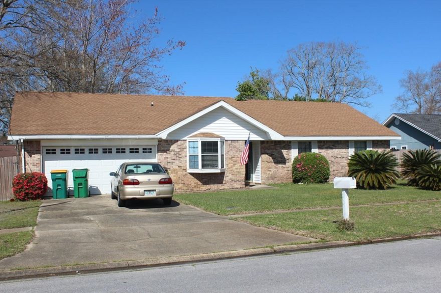 NEW ROOF going on this week.  Brick home has a spacious living area with vaulted ceilings and wood floors, accompanied with a fireplace and an additional climate controlled Florida room  The kitchen features arched doorways, wood floors, a dining area with a bay window, and a pantry. An additional climate controlled storage room sets off from the 2 car garage, perfect for handy work or extra storage. large back yard and a privacy fence. Home is sold AS IS