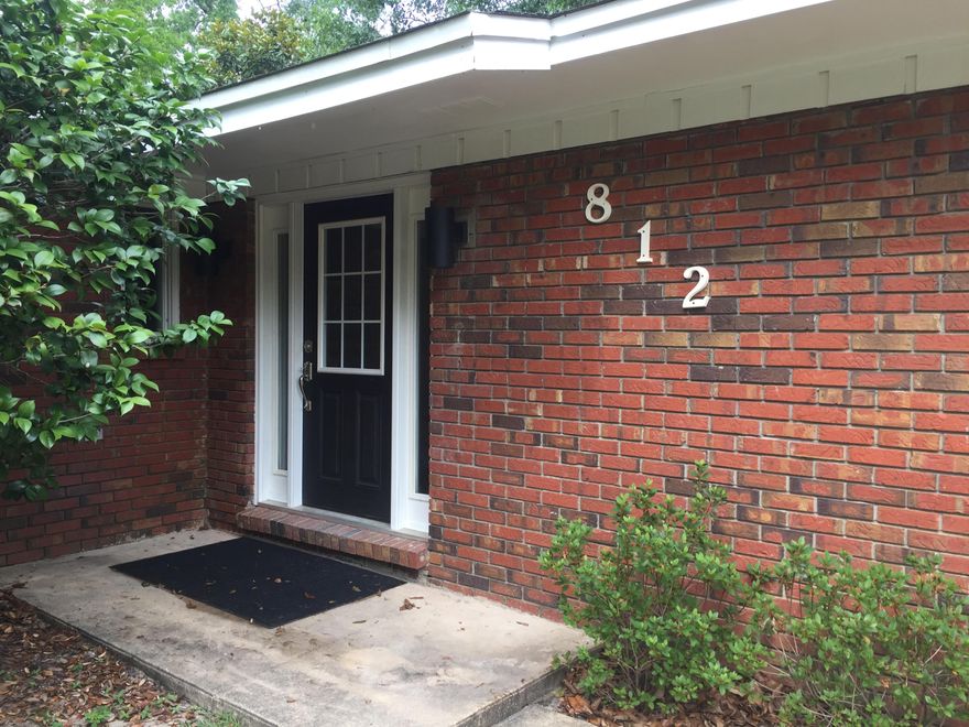 This all brick house is located on a large corner lot in a well established neighborhood near the bay in Niceville. Within walking distance to several churches and parks, a 5 minute drive to some of the top rated schools in the state, a twenty minute drive from Eglin AFB and the beautiful beaches of Destin, this house is truly in the middle of everything the area has to offer. The yard has been professionally landscaped with magnolias, azaleas, camellias, sago palms and sweet viburnum with mature oaks trees in the front and back yard. The house has an oversized side-entry garage, an open living area floor plan and travertine floors throughout. The kitchen/dining area features granite counters, breakfast bar and stainless steel appliances and is situated between the two living areas...