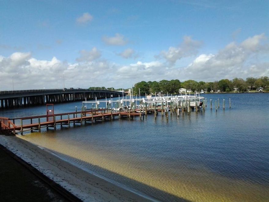 Don't miss out on this opportunity for affordable waterfront living directly on Cinco Bayou w/ easy access to Choctawhatchee Bay and Gulf of Mexico + Crab Island fun! This 2bd2ba unit has a fantastic lay out and incredible use of the nearly 1300 sq ft! Kitchen is super functional with large pantry and additional room in laundry area which is large enough to house spare fridge that comes with the unit. Bayou can be seen from the large living area but when you step out onto the balcony you immediately know the real reason you want this unit!! The views for morning coffee are spectacular! Large master bd and bath make it seem this unit is much bigger than it is. LL #303 comes with assigned covered parking space + additional storage unit steps from front door . See supplement for  more info...