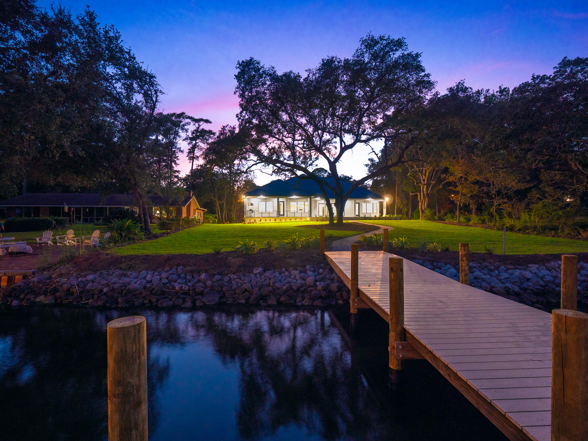 A rare opportunity to own a custom, new construction, waterfront property in Niceville. This Rocky Bayou waterfront property sits on .69 acres on a quiet street lined with mature oak trees. The moment you step through the double french doors, you are greeted by breathtaking views of glistening Rocky Bayou. You'll be reassured that this home containing 5 large bedrooms, a large study, 4.5 baths was built by one of Niceville's best custom home builders. The bright living room features a coffered ceiling, built-in cabinetry, gas fireplace, plenty of large impact windows, and sliding glass doors that provide panoramic views of the backyard and water. The gourmet kitchen has an abundance of cabinet/counter space and features Wolf and Sub-Zero appliances and a built-in Miele coffee system