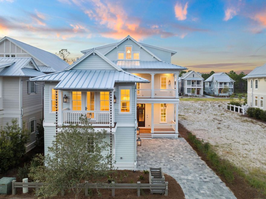 A masterfully designed home in WaterColor Phase 5, this custom estate offers five bedrooms, a private guest suite, an office, and multiple entertainment spaces, all seamlessly connected by a private elevator. With 800 square feet of outdoor porches, a two-car garage, and a resort-style pool, this home is a rare opportunity to experience the height of luxury along 30A.The first floor welcomes you with expansive open-concept living, where walls of windows bathe the space in natural light. The chef's kitchen is a work of art, featuring custom natural walnut cabinetry, a butler's pantry, and a bespoke bourbon & wine bar, framed by a striking antique beam that defines the space. The painted brick fireplace is complete with a Summer Option upgrade that provides ambiance without increasing indoor temperatures, and is crowned by a reclaimed antique beam mantle.
Designed for effortless indoor-outdoor living, a full wall of folding glass doors leads to the private pool and outdoor retreat, offering serene views over protected forestry. The spacious flex room above the garage, complete with a full bath and private porch, provides endless possibilities for an entertainment space, gym, or guest retreat.
On the third floor, a versatile entertainment roomcomplete with a wet bar, flex spaces, and a private office or additional sleeping areaoffers a secluded retreat with endless potential. Every floor is designed for comfort and convenience: You'll find wet bars on all three levels, a first-floor laundry room, pre-wiring for whole-home audio, smart technology, and an EV charging station in the garage.
Positioned to take full advantage of stunning front-facing views over the pool and common green space, as well as peaceful rear views, this home is perfectly situated for both privacy and proximity to the WaterColor Beach Club, resort pools, and 30A's world-class beaches.