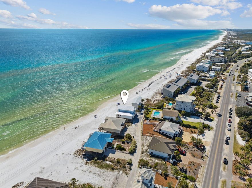 Positioned along a private road on the tranquil West end of 30A, this extraordinary Gulf-front residence captures sweeping, unobstructed views of the emerald waters and sugar-white sands, stretching endlessly in both directions. Thoughtfully renovated in the spring of 2024 and beautifully furnished with a refined coastal aesthetic, the home effortlessly blends classic beach house charm with modern luxury--making it a compelling retreat for personal enjoyment and long-term ownership.Every element of the home has been curated to complement the surrounding natural beauty while providing a sense of ease and comfort. A soothing coastal color palette and low-maintenance finishes create a relaxed, livable atmosphere, ideal for carefree beachside living. Vaulted ceilings and abundant natural light enhance the spacious interior, which features 4 well-appointed bedrooms, 2.5 baths, and two generous living areasoffering flexibility for entertaining, hosting, or simply unwinding in style.

The open-concept kitchen and dining space is a natural gathering point, thoughtfully designed for both everyday living and elevated entertaining. A sleek wet bar adds a layer of sophistication, perfect for sunset cocktails or weekend celebrations with friends and family.

Step outside to discover multiple outdoor living areas that embrace the serene Gulf-front setting. An expansive covered porch offers a front-row seat to the ever-changing colors of the sea and skyideal for morning coffee, quiet afternoons, or golden-hour gatherings. A dune-side covered deck brings you even closer to the shoreline, where the rhythmic sound of the surf creates a calming, meditative ambiance.

Offered fully furnished, 103 Fort Panic presents a rare, turnkey opportunity for those seeking a beautifully updated coastal sanctuary in one of the most coveted and peaceful stretches of Scenic Highway 30A.
