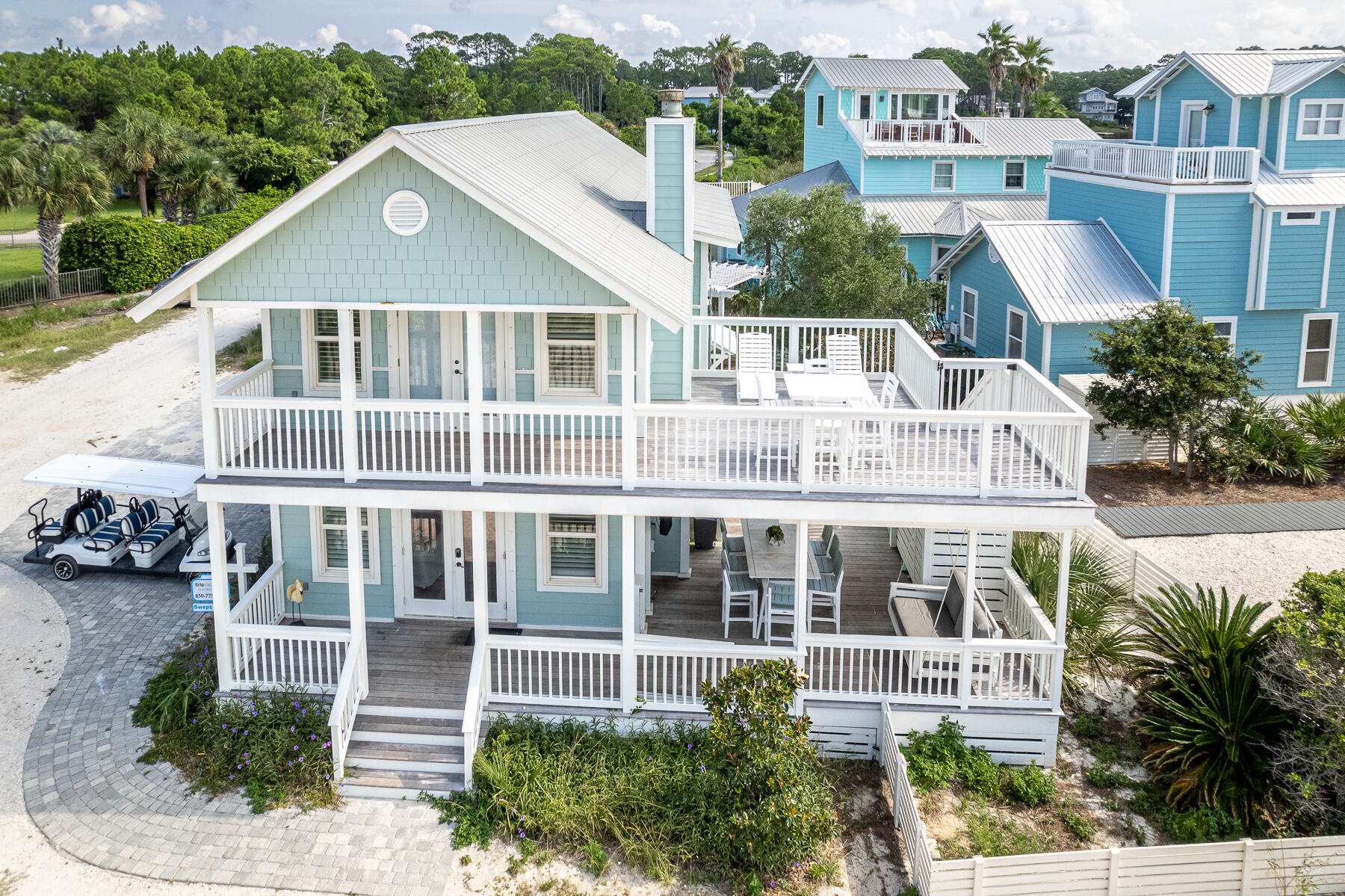 Overlooking the serene Gulf of Mexico on 30A's quiet west end, this stunning 4-bedroom, 3-bath coastal home offers sweeping views of both the Gulf and Oyster Lake. This 2-story retreat features breathtaking vistas from both levels and boasts numerous recent updates, including IPE Brazilian hardwood decking and remodeled kitchen and bathrooms. Additional high-end finishes include impact-rated windows and doors, functional wooden hurricane/plantation shutters, newer HVAC units, a tankless water heater, and durable Hardi-board siding. The bright and inviting living area includes a fireplace and abundant natural light with Gulf views. The gourmet kitchen is equipped with custom cabinetry, professional-grade stainless steel appliances, including a Subzero refrigerator and Viking gas range. The home was freshly painted in 2019, and a 24kW generator was installed in 2021. Outside, you'll find ample storage for paddleboards and kayaks in the charming backyard sheds. Relax or entertain on one of the three covered porches or enjoy the sunrise and sunset from the spacious deck. With no HOA fees and two nearby beach access points, both offering parking, you're just steps from the sand. Paddleboard down the beach from the community's deeded deck, or take a quick bike ride to Gulf Place Town Center, The Vue on 30A, and Santa Rosa Golf & Beach Club.