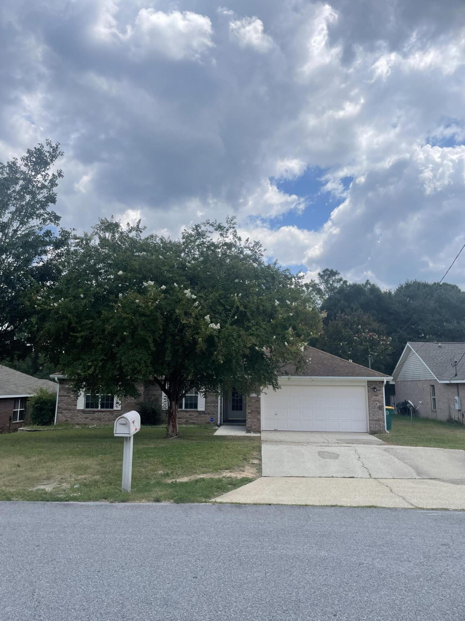 This is a well-maintained 4/2 home on over 1/2 acre. Spacious family room is accented by a plant ledge. Kitchen is highlighted with a modern back splash, ample amount of cabinet & counter-space with a window above oversize sink to allow natural light. Dining area overlooks the backyard. Large pantry & laundry area with washer and dryer included. There are 3 closets in the foyer. The master suite has 2 walk-in closets a double vanity with garden tub & separate shower. The deck overlooks the terraced privacy fenced back yard with a storage building. Conveniently located to schools, hospital, dining and shopping.