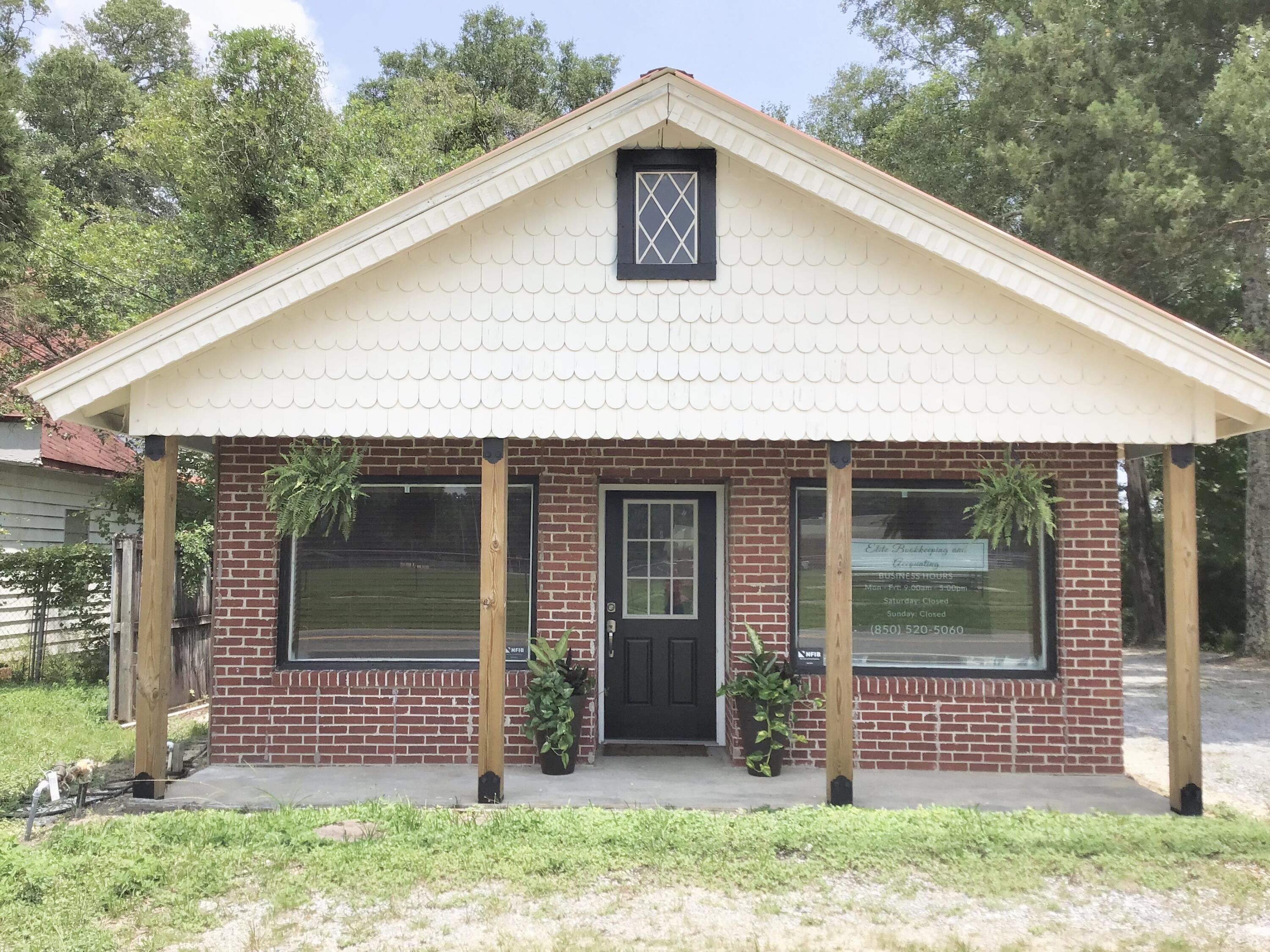 Prime commercial opportunity on Florida Highway 83! This beautifully remodeled building offers 50 feet of road frontage with an impressive annual average daily traffic count of 10,000, ensuring excellent visibility for your business.  Step through the front doors into a spacious waiting or reception area.  Down the hall you will find a bathroom, functional workspace, private office, break room, large conference room and two additional offices.  Multiple entrances provide easy access to different areas, including workspace and conference room.  The back of the property includes a large storage building and a covered concrete pad.  Move-in ready and perfectly located, this property is ideal for launching or expanding your business.  Don't miss this incredible opportunity.