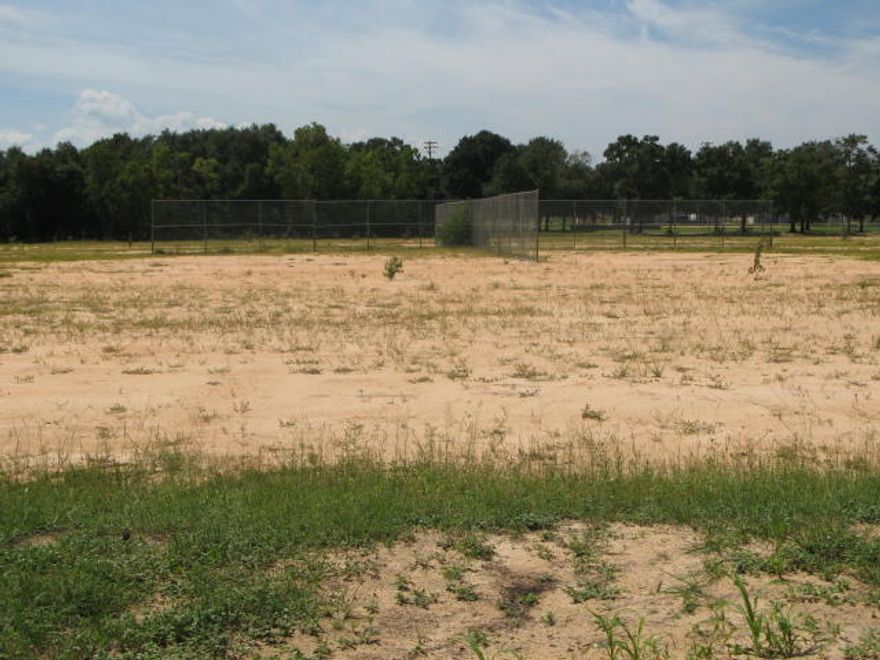 Cleared level land that has been used as baseball practice fields for many years. Located adjacent and east of the West Defuniak Springs Elementary School. Ideal for single family or multi-family development. Power, water and sewer is located nearby.