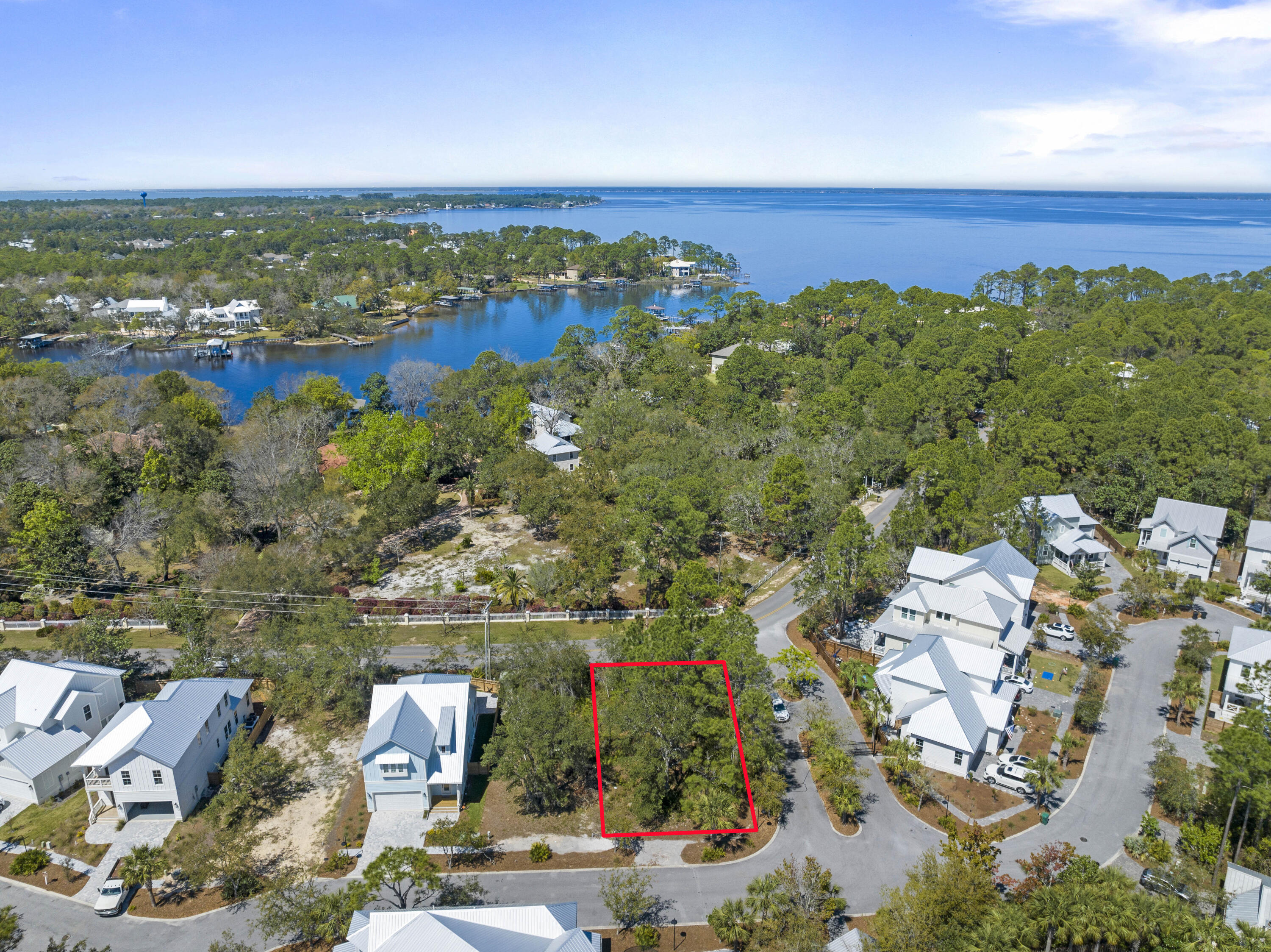 Great flat, buildable lot located in the lovely gated community of Hidden Grove. Bordered by Point Washington State Forest and featuring a charming community pool and Florida Cottage style construction, this quaint little hidden gem of a neighborhood is great for full time living with quick access to many nearby shops, restaurants as well as the beautiful beach of South Walton on 30a! You'll appreciate being so close to everyday conveniences such as Publix, Grand Boulevard Shopping Center, Sandestin Resort, Silver Sands Outlet Malls, Walmart, Sacred Heart Hospital and so much more.