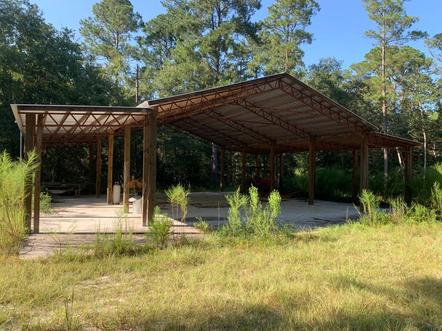 25 Acres inside the secured and gated prestige community of Walton Plantation with a creek running through the property! This parcel features a new very large open barn with concrete slab, several hunting plots and shooting house/ deer stands, and a camp area with shipping container style cabin. there is an on site well installed.  This community of Walton Plantation does have some common elements shared including a shooting range and open air chapel.  see ALL of the photos.