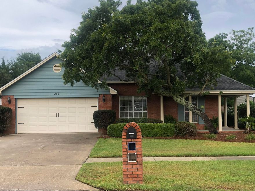 This spectacular 3 bedroom/2 bath brick home with a wrap around porch is a MUST SEE!!!!! It has a gorgeous open lay out that includes a large family room, dining room and breakfast nook complete with a fireplace and french doors that open up to a beautifully landscaped and very private backyard. The kitchen has been updated with newer appliances, white cabinets and exceptional granite countertops. The Master bathroom has been updated with double vanity granite sinks, and an amazing tile and glass shower with a waterfall showerhead that pours from the ceiling above! The master closet has custom shelving. This charming home has so much to offer! It has gas hook ups, a 2 car garage, new roof, sprinkler system, privacy fence, plus its in an ideal location. What more could you ask for??