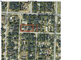 This property has 4 lots and has a house and a trailer on it, room to fit more