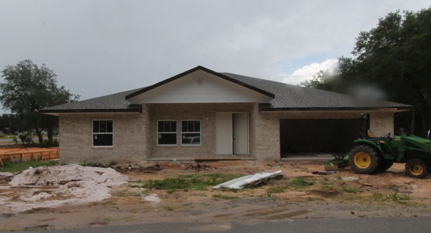 Entered for comps. only. Home sold prior to listing. Pics. of a similar home. Welcome to Temple Park, a 40 lot development is Shalimar with both underground utilities and sidewalks. This 4/3 custom brick home has super curb appeal. There are 10 Ft. ceilings w/ impressive crown molding, LVP flooring throughout the main living areas, tile in baths, and 5 1/4'' baseboard throughout. As you enter the home through the covered front porch, the formal dining room is on your left. As you continue down the hallway, you will then enter the chef's delight kitchen which boasts custom painted Ivory cabinetry, granite countertops, a large pantry, and stainless appliances (including an oversized commercial grade refrigerator/ freezer).