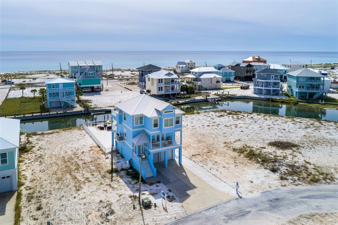 ''Sand Kastle Kottage'' This completely renovated home boasts breathtaking views of both the Gulf of Mexico and Santa Rosa Sound, from every bedroom. Upon entering this upscale and welcoming home, you will be adorned with gorgeous wood-like tile flooring throughout the living area and bedrooms, a coastal color scheme featuring shades of tan, blue and white, as well as an open floor plan to create a welcoming ambiance from the moment you step through the front door. The spacious master bedroom offers its own relaxing oasis, with coastal decor and stunning views looking down the Gulf of Mexico's coastline. The ensuite master bathroom is truly a sight to see, surrounded by a granite countertop, along with a gorgeously-tiled walk-in shower. Each guest bedroom offers a private balcony & bathroo