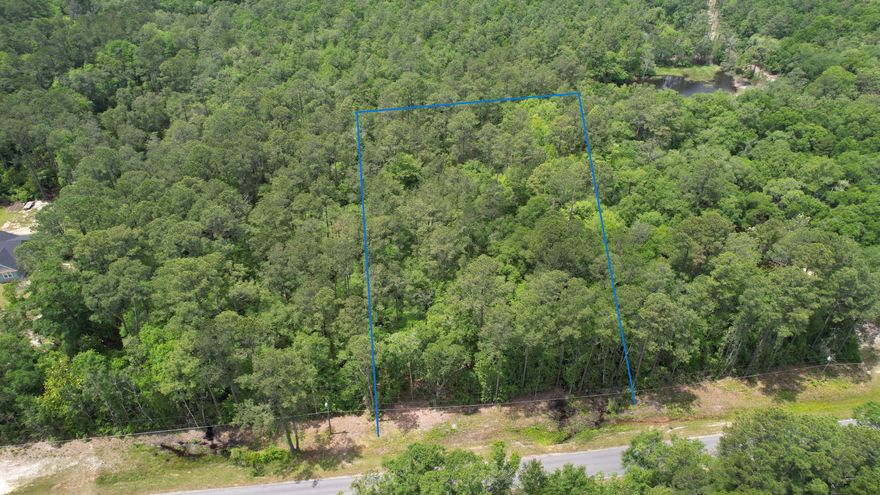 Embrace the peacefulness of nature on this 2-acre wooded retreat, offering the perfect canvas for your dream home. Surrounded by towering trees and lush foliage, this picturesque parcel provides privacy and seclusion. Imagine waking up to the soothing sounds of birds singing, turkeys gobbling and the gentle rustle of leaves, as sunlight filters through the treetops above. With ample space for your ideal residence and room to roam amidst nature's beauty, this wooded oasis invites you to create your own sanctuary. Seize the opportunity to build your dream home amidst the serenity of the forest.