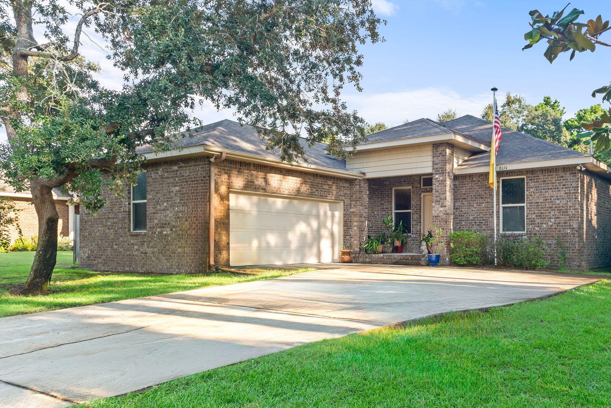 Stylish Brick Home in Coastal Navarre - Your Florida Dream Starts Here! Step into comfort, style, and coastal charm with this beautifully maintained 4-bedroom, 2-bath brick home located in one of Navarre's most sought-after communities. This property isn't just move-in ready--it's packed with features that make everyday living feel like a getaway. From the moment you enter, soaring 12-foot ceilings and elegant finishes set the tone. The formal dining room, recessed lighting, and a mix of laminate wood, tile, and carpeted flooring create a warm, inviting atmosphere. The kitchen is a showstopper - granite countertops, stainless steel appliances, ample cabinetry, and a spacious breakfast bar make it perfect for hosting or relaxing at home. The oversized primary suite is a true retreat, complete with tray ceilings, up-lighting, and an attached bonus room that offers flexible use - ideal for a nursery, home office, fitness space, or quiet reading nook. The en-suite bath offers spa-like luxury with a custom tile shower, soaking tub, dual vanities, and a generous walk-in closet. A split floor plan ensures privacy, with three additional bedrooms and a second full bath thoughtfully placed. The living room features French doors that open to a large patio, inviting you to enjoy Florida's outdoor lifestyle year-round. The fenced backyard is a peaceful oasis with fruit trees and plenty of space for gardening, relaxing, or entertaining. Located just minutes from the sugar-white sands and emerald waters of Navarre Beach, this home offers the perfect blend of tranquility and convenience. Enjoy easy access to parks, shopping, dining, and nearby military installations including Hurlburt Field and Eglin AFB. Whether you're searching for a forever home, a coastal escape, or a smart investment - this property delivers. Schedule your showing today and experience the lifestyle you've been waiting for.
