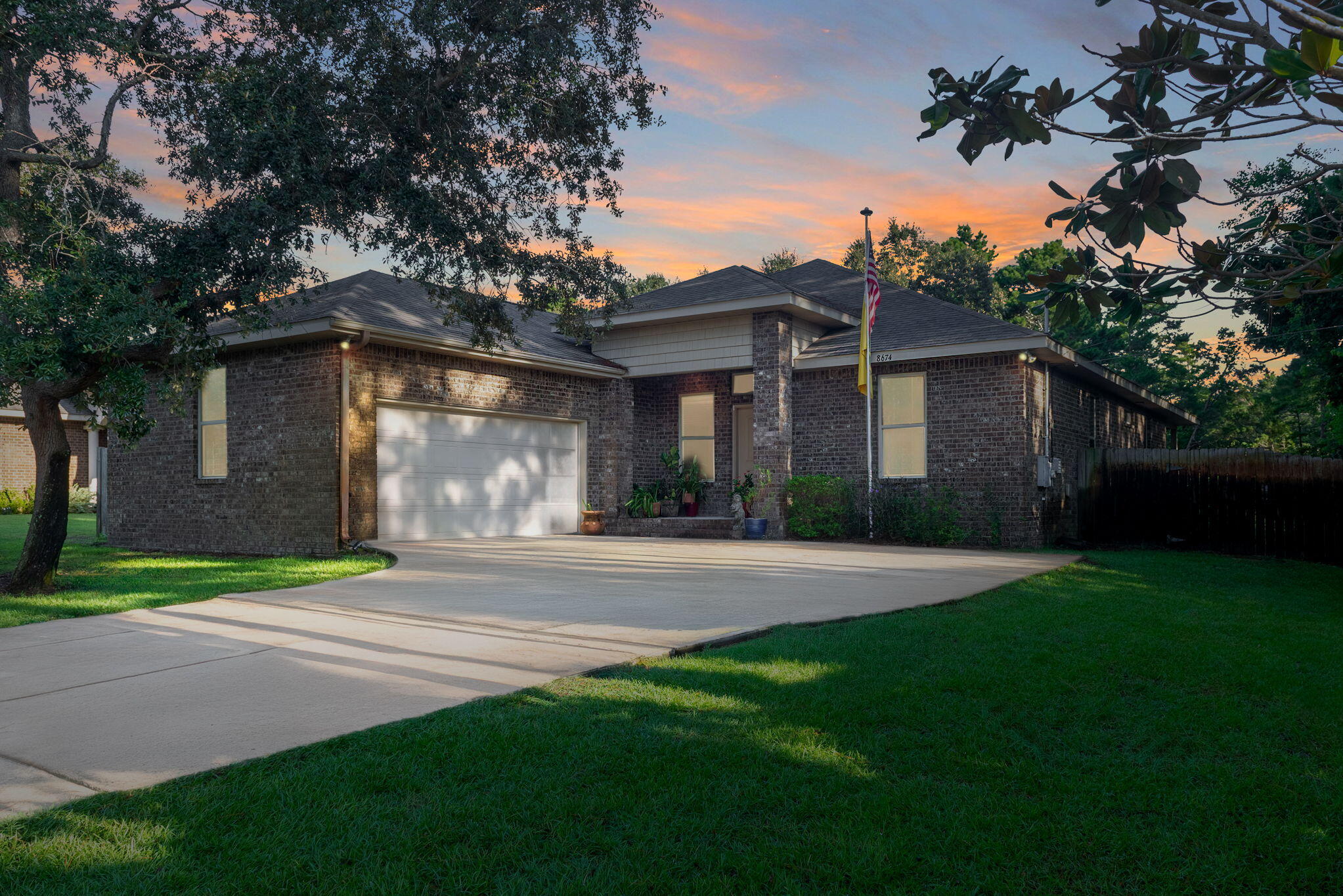 Stylish Brick Home in Coastal Navarre - Your Florida Dream Starts Here! Step into comfort, style, and coastal charm with this beautifully maintained 4-bedroom, 2-bath brick home located in one of Navarre's most sought-after communities. This property isn't just move-in ready--it's packed with features that make everyday living feel like a getaway. From the moment you enter, soaring 12-foot ceilings and elegant finishes set the tone. The formal dining room, recessed lighting, and a mix of laminate wood, tile, and carpeted flooring create a warm, inviting atmosphere. The kitchen is a showstopper - granite countertops, stainless steel appliances, ample cabinetry, and a spacious breakfast bar make it perfect for hosting or relaxing at home. The oversized primary suite is a true retreat, complete with tray ceilings, up-lighting, and an attached bonus room that offers flexible use - ideal for a nursery, home office, fitness space, or quiet reading nook. The en-suite bath offers spa-like luxury with a custom tile shower, soaking tub, dual vanities, and a generous walk-in closet. A split floor plan ensures privacy, with three additional bedrooms and a second full bath thoughtfully placed. The living room features French doors that open to a large patio, inviting you to enjoy Florida's outdoor lifestyle year-round. The fenced backyard is a peaceful oasis with fruit trees and plenty of space for gardening, relaxing, or entertaining. Located just minutes from the sugar-white sands and emerald waters of Navarre Beach, this home offers the perfect blend of tranquility and convenience. Enjoy easy access to parks, shopping, dining, and nearby military installations including Hurlburt Field and Eglin AFB. Whether you're searching for a forever home, a coastal escape, or a smart investment - this property delivers. Schedule your showing today and experience the lifestyle you've been waiting for.