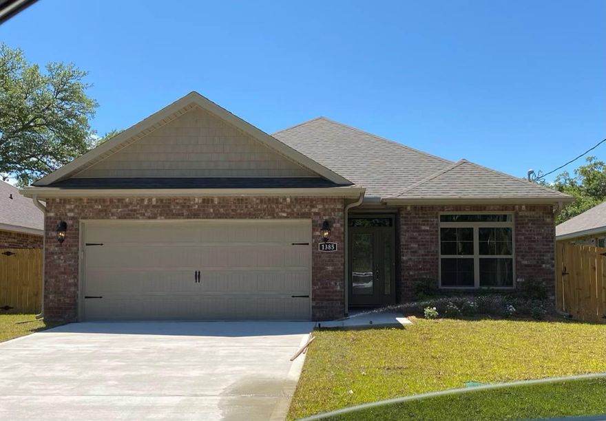 Available August 5! This nearly new 3 Bedroom 2 Bath brick home offers a spacious open floor plan and fenced yard.  Plank tile flooring in main living areas with carpet in all bedrooms. The master bedroom offers a tray ceiling and large walk in closet. Master bath offers separate shower, garden tub and double sink vanity.  Washer and Dryer provided AS-IS.  Pets on case by case basis with non refundable fee.