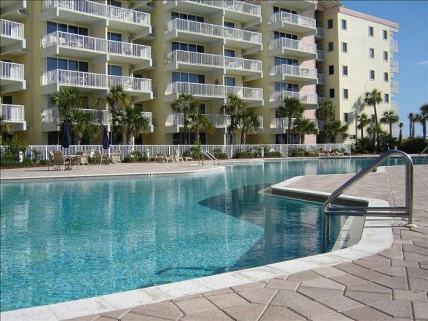 Stop dreaming and start enjoying the sugar white beaches of the Gulf of Mexico! Spacious living room with high volume ceilings and sliding glass doors that lead out to on your tiled patio which is so convenient to the hot tub and pool. Light and bright kitchen with solid surface counter tops, white on white appliances, pantry and a breakfast bar that is very spacious and opens to the living area to maximize the views, entertainment, and family and friend gatherings. Master bedroom also has sliding glass doors to the patio. Master bath has double vanities, separate shower and a soaking tub. Additional bedroom allows privacy for guests and a bunk room is a definite plus...This unit will easily sleep 8 people. When you stay at Destin West Gulfside, you have access to the Bayside via