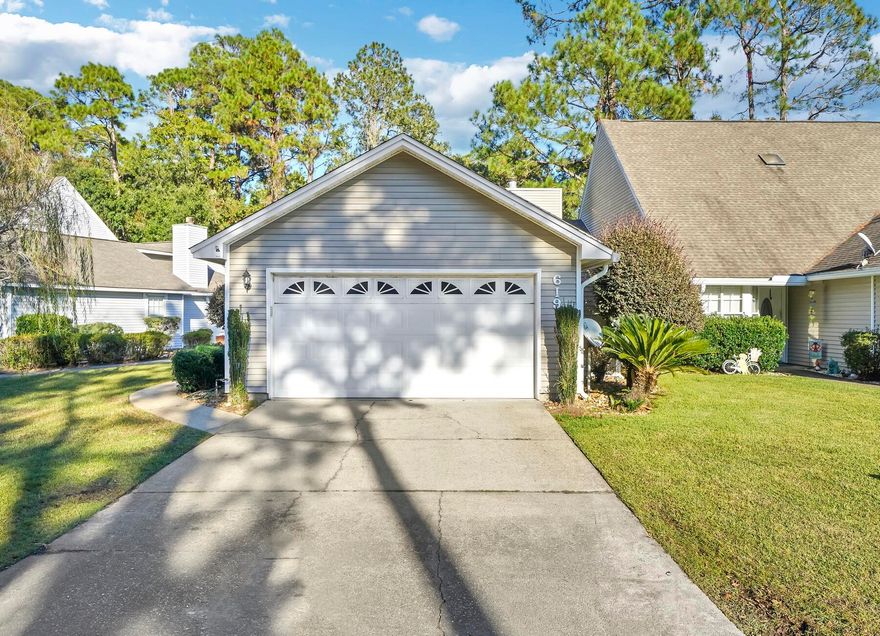 Welcome to the Emerald Gardens of Fort Walton Beach! You couldn't pick a better location for proximity to both Eglin AFB and Hurlburt Field! This beautiful home is ready for its new owner, step inside and you will be greeted by the rich walnut wood floors and neutral ceramic tile with a gas fireplace giving you a warm and welcoming feeling. The kitchen features all stainless-steel appliances including a brand-new gas stove and a brand-new microwave. Plenty of cabinet and counter space to enjoy cooking in your new home. The plantation shutters on the doors and windows add a touch of sophistication and privacy. Enjoy the privacy of your own fenced in patio where you can lounge, grill, exercise, sunbathe or whatever you enjoy! The community pool is a conveniently located directly behind the backyard, and the home is one of the few true 2 car garages in the community. Roof is from 2018, and the HOA handles maintenance and landscaping, so you can enjoy more time doing the things you love!
