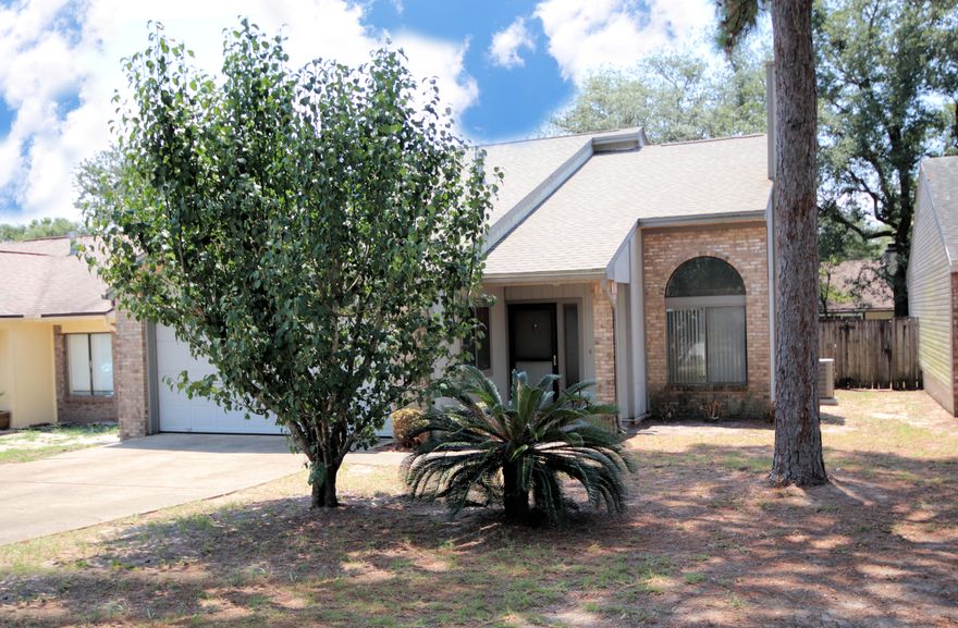 Spacious 3 bedroom 2 bath home features a large open living space with vaulted ceiling and adjacent dining area, a fireplace, fenced-in backyard with patio, and a 2-car garage. This home has new carpet and paint throughout. Other recent upgrades include; tile in both bathrooms, wood plank flooring in the living and dining area, a gas water heater, gas stove, disposal, and new garage door opener. This is a great home in one of the most convenient locations in Niceville, close to schools, bases and shopping. Come see it today!