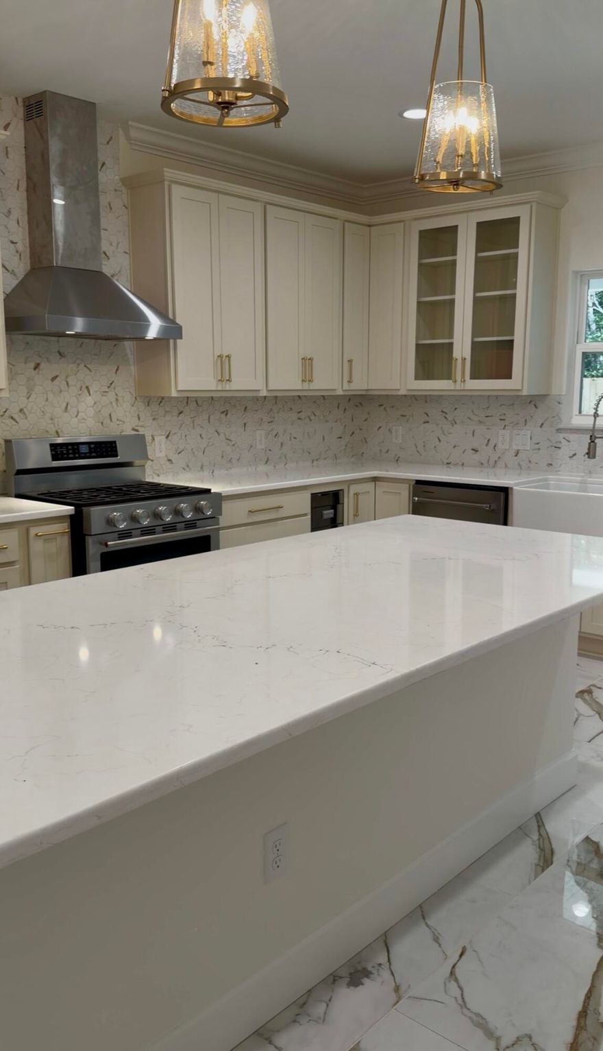 Experience unmatched sophistication in this stunning all-brick home featuring 9ft ceilings and dramatic 10ft tray accents in the living room and primary suite and crown molding throughout. Designed for hosting, the open-concept layout seamlessly blends high-end finishes with functional luxury.The kitchen features cream soft close cabinetry and quartz countertops. Oversized island, stainless KitchenAid appliances, oversized fridge/freezer combo, gas range, farm sink, and custom rice dispenser.All 5 bathrooms feature floor-to-ceiling tile showers with a bench seating and niche and glass enclosures. The primary retreat boasts a freestanding soaking tub and 6'x6' all tiled shower. Tile in common areas are 24" x 48" large format tile, 12" x 24" tile in bathrooms, LVP in bedrooms, and upgraded plumbing/electrical fixtures throughout.

This home features a tankless gas water heater. 

The ultimate backyard setup awaits with a full outdoor kitchen, featuring granite countertops, a built-in natural gas BBQ, and a stainless sink.

and is pool ready, featuring a sub panel and pool water supply. The yard is equipped with a jet pump well and irrigation system, surrounded by a 6 foot wooden privacy fence. 

This is the perfect place to entertain inside and out. 

This home featured MANY change orders. Contact for further info for upgrades not disclosed in contract price. 