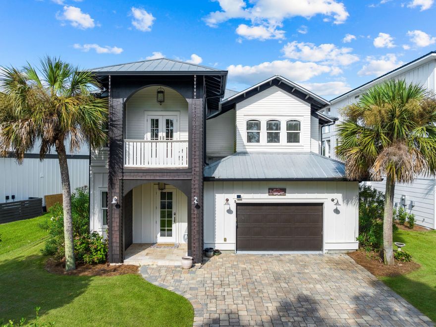 This amazing five-bedroom coastal retreat is superbly located close to the beach and steps from the resort-style pool. Ideal for family vacations, the fenced-in backyard adjoins the expansive pool area. Enjoy views of rock waterfalls and three-tiered pools from the comfort of your own private porch. Located on a leafy street, this beautiful beach house has a wide pavered driveway leading to the oversized garage and covered front porch. Step inside this Tuscan-style beauty to appreciate the generous family room with ample space for entertaining and family living. The sitting area is a comfortable place to put your feet up and watch favorite movies and sports together. Feature walls, hand-troweled Venetian plaster and a heavy wooden mantle complement the log-effect gas fireplace. Gleaming wood flooring adds to the upscale ambience in the formal dining area, with sliding doors opening directly onto the barbecue terrace. The open-concept kitchen is a social space fully equipped with custom cabinetry and commercial-grade appliances. Cabinet underlighting highlights the attractive tile backsplash, while the huge walk-in pantry keeps everything neatly stored away. Lit by a trio of pendular light fixtures, the huge island provides additional seating for casual dining and happy hour drinks. Beneath the cool Carrara marble countertop, a beverage refrigerator and a microwave are neatly situated. The first-floor bedroom suite offers flexible step-free living with three further guest suites and a bunk room on the second floor. The swanky master suite is defined by chandelier lighting, and the stunning bathroom includes a garden tub. Second-floor porches to the front and rear of the property provide quiet areas for enjoying a quiet cup of coffee before the day begins. This well-located home in the gated community of Cypress Breeze Plantation is a breezy golf cart ride from the beach. In the evening, stroll to Gulf Place on nearby 30A where boutique shops, restaurants and live entertainment make this a popular hub. Further afield, Camp Helen State Park, Grayton Beach State Park, the Village of Baytowne Wharf and the towns of Alys Beach and Seaside, Florida, offer something for all ages and tastes. 