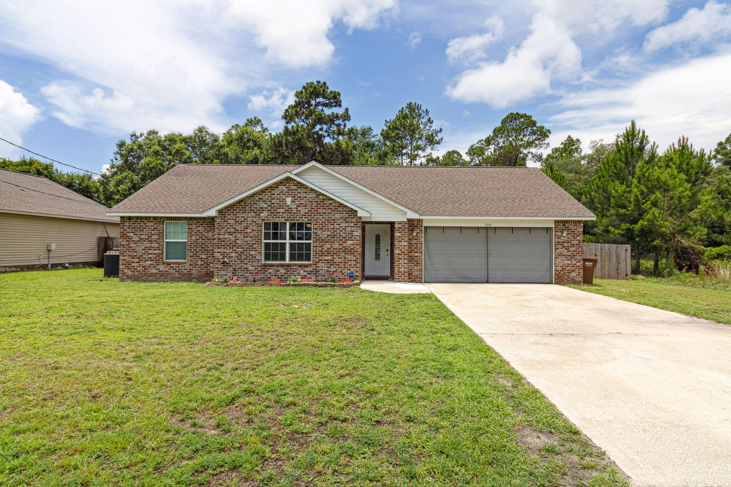 Beautifully Maintained Home in Navarre - VA Assumable loan at 3.75% for qualified buyers!This home is conveniently located to the pristine Gulf Coast beaches and nearby military bases, making it ideal for both beach lovers and military families.This charming and well-kept residence features tasteful updates and carefully selected finishes that enhance both style and functionality throughout. The kitchen has been refreshed with white painted cabinetry, custom knobs, newer stainless steel appliances, and brand new cabinets and dishwasher. The luxury vinyl plank flooring flows seamlessly through the main living areas, complemented by carpeted bedrooms for added comfort. Enjoy peace of mind with major upgrades including a new water heater, new sewer waste/pump grinder, and a new privacy fence. The home is also equipped with a smart doorbell security system and window and door sensors, which will convey with the property for added safety and convenience.
The large, flat backyard features mature trees, swing set, and ample room for entertaining, gardening, or simply enjoying time outdoors with family and friends.
Whether you're a first-time buyer or looking for a home with instant equity potential, this one checks all the boxes. Schedule your showing today before it's gone!