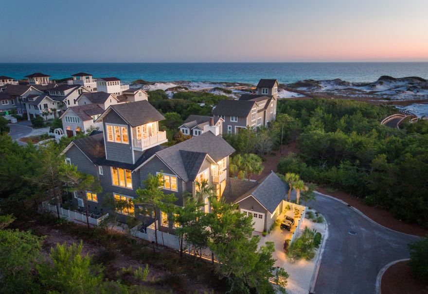 This custom residence in WaterSound Beach is sure to impress. Sitting only one homesite off the beach this home allows for unobstructed Gulf views which are amazing. Upon entering the courtyard one immediately appreciates the soothing sounds of the water feature. The outdoor area is complete with fire pit, summer kitchen, TV, powder bath & heated pool. This private retreat is the perfect spot for entertaining. The extraordinary use of skillful millwork & craftsmanship is evident in the custom trim, moldings, doors & cabinetry throughout the home. There is an abundance of natural light streaming through the plethora of windows on every floor. All of these upgrades set the tone for a gracious, relaxed ambience which is found throughout this one of a kind, unique & inspired beach home! The interiors encompass extraordinary finishes & impressive attention to detail including a floating staircase, elevator, raised ceilings & oak floors.  The second level living area, dining room & kitchen are accentuated by a raised beamed ceiling & custom fireplace.  The gourmet kitchen is inviting with all of the highest end accoutrements including Wolf & Subzero appliances & wet bar, no element has been overlooked. There is a spacious master bedroom on both the first & second floors. Each of the guest bedrooms exude a perfect beach vibe with a calming coastal palette & functional designer touches.  The crown jewel of the home is the tower with panoramic views of the Gulf of Mexico.  Perfectly blending form & function, this home will leave a lasting impression!