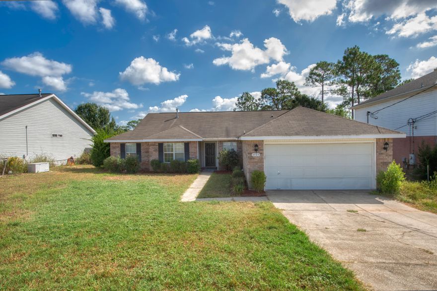 Welcome to your centrally located South Crestview home that offers a split bedroom open floorplan. Enter the large eat-in kitchen with granite countertops, stainless steel appliances, an island, a pantry, and lots of cabinets. The laundry room is off of the kitchen. In the living area, you will find a lovely fireplace for having friends over or family gatherings. Outside of the living area, you will find a covered patio with a large fenced in back yard. Children and pets have a great outdoor space to play and enjoy sunny days. The master bedroom is large. The master bath has a granite countertop with a double vanity, large walk-in closet, and a garden tub. There are three additional bedrooms and a bath on the other side of the home. This is a must see! Schedule a showing today.