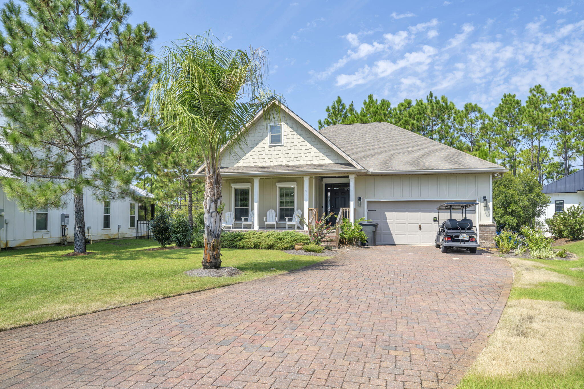 This charming 3-bedroom, 2-bath beach home is nestled in a gated community located near Shunk Gulley, Gulf Place, and the Ed Walline Beach Access, placing shopping, dining, and our gorgeous white-sand beaches right at your fingertips. The split-bedroom floor plan ensures privacy, with the primary suite tucked away at the back of the home, while the open-concept main living area offers the perfect setting for entertaining, relaxing, or enjoying meals together. This home boasts a newer A/C as well as a new stainless steel french door refrigerator (2024), all adding to the comfort of this well-cared-for home.What makes this property different? Backing up to a protected nature preserve, the home offers a private and tranquil setting where you can bask in the sun while observing all forms of nature & birdwatching while enjoying the Florida breeze. The recently added outdoor space has been thoughtfully designed for comfortable gatherings, featuring fresh brick pavers, custom landscaping, two oversized swings, and plenty of seating around a firepit and BBQ area. When not at the beach, enjoy the massive resort style swimming pool featuring gated access, stone boulders with swim shelves & intimate enclaves with numerous waterfalls thus making it an amazing water experience for you and your guests.
With a durable hardie board & partial brick exterior, as well as easy pull-down Hurricane window & door shutters, this beach retreat combines beauty and peace of mind, making it the perfect second home or coastal escape.