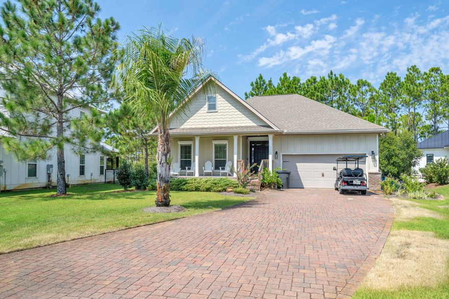 This charming 3-bedroom, 2-bath beach home is nestled in a gated community located near Shunk Gulley, Gulf Place, and the Ed Walline Beach Access, placing shopping, dining, and our gorgeous white-sand beaches right at your fingertips. The split-bedroom floor plan ensures privacy, with the primary suite tucked away at the back of the home, while the open-concept main living area offers the perfect setting for entertaining, relaxing, or enjoying meals together. This home boasts a newer A/C as well as a new stainless steel french door refrigerator (2024), all adding to the comfort of this well-cared-for home.What makes this property special? Backing up to a protected nature preserve, the home offers a private and tranquil setting where you can bask in the sun while observing all forms of nature & birdwatching while enjoying the Florida breeze. The recently added outdoor space has been thoughtfully designed for comfortable gatherings, featuring fresh brick pavers, custom landscaping, two oversized swings, and plenty of seating around a firepit and BBQ area. When not at the beach, enjoy the massive resort style swimming pool featuring gated access, stone boulders with swim shelves & intimate enclaves with numerous waterfalls thus making it an amazing water experience for you and your guests.

With a durable hardie board & partial brick exterior, as well as easy pull-down Hurricane window & door shutters, this beach retreat combines beauty and peace of mind, making it the perfect second home or coastal escape.