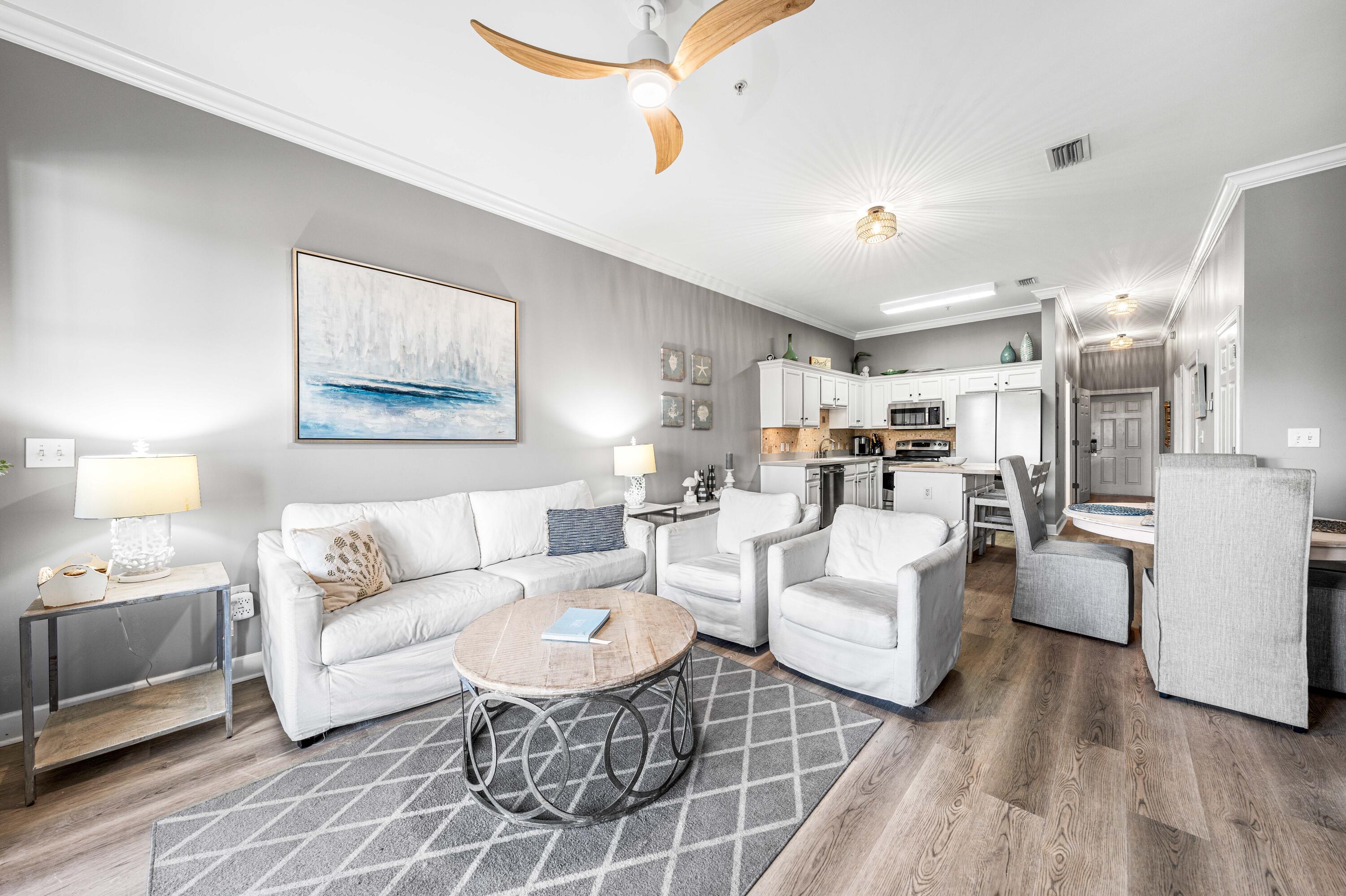 New LVP floors just completed throughout. This 3BR/2BA condo is a 5 minute walk to the beach and is being sold fully furnished with a six-seater golf cart. Built-in bunks in one of the guest bedrooms increases the capacity for total sleep count & rental potential. Motivated sellers.