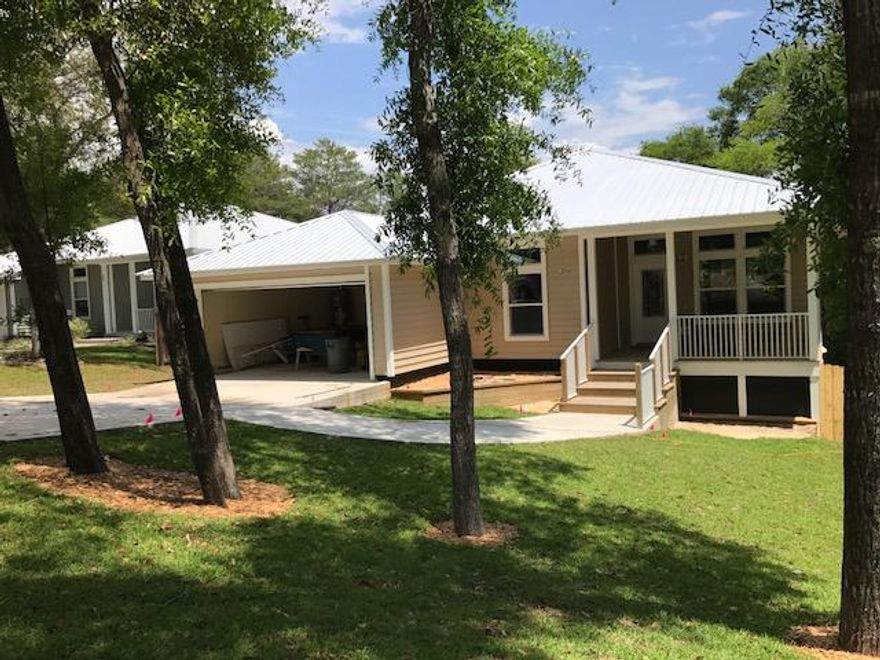 Great opportunity to own a brand new home with tons of upscale features! This home has beautiful landscaping and a spacious front porch to add to its curb appeal. Split, open floor plan with tile floors, 10' ceilings, and carpet in the bedrooms. Kitchen is loaded with granite countertops, gas stove, stainless steel appliances, recessed lighting over the breakfast bar, and huge kitchen pantry. Master bedroom is located in the back of the home with double vanity in bathroom and enormous walk in closet! The master provides private access to the screened back porch with beautiful wooded view! Large backyard with 6' privacy fence. This home offers close proximity to military bases, great schools, restaurants, and state park. Call today for your showing!