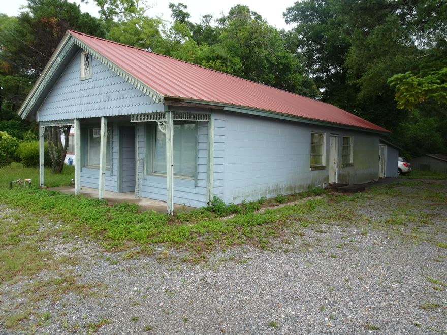 BACK ON THE MARKET - BUYER COULDN'T CLOSE!! Perfect size office building for a small business or professional office. Currently the layout is a receptionist area and waiting room, 2 main offices and room for an additional work station. There is a break room space plus copy room area and 1 bath (handicapped). Back of the office areas is a large storage area with 2 additional storage closets. Floors are ceramic tile plus central air and heat. Heated and cooled area is 957 sq ft with 1,447  sq ft under roof. Parking is on the side and back of the building. In the back of the lot is an older barn that is need of some work. City of DeFuniak Springs verbally verified the zoning to be C-2.