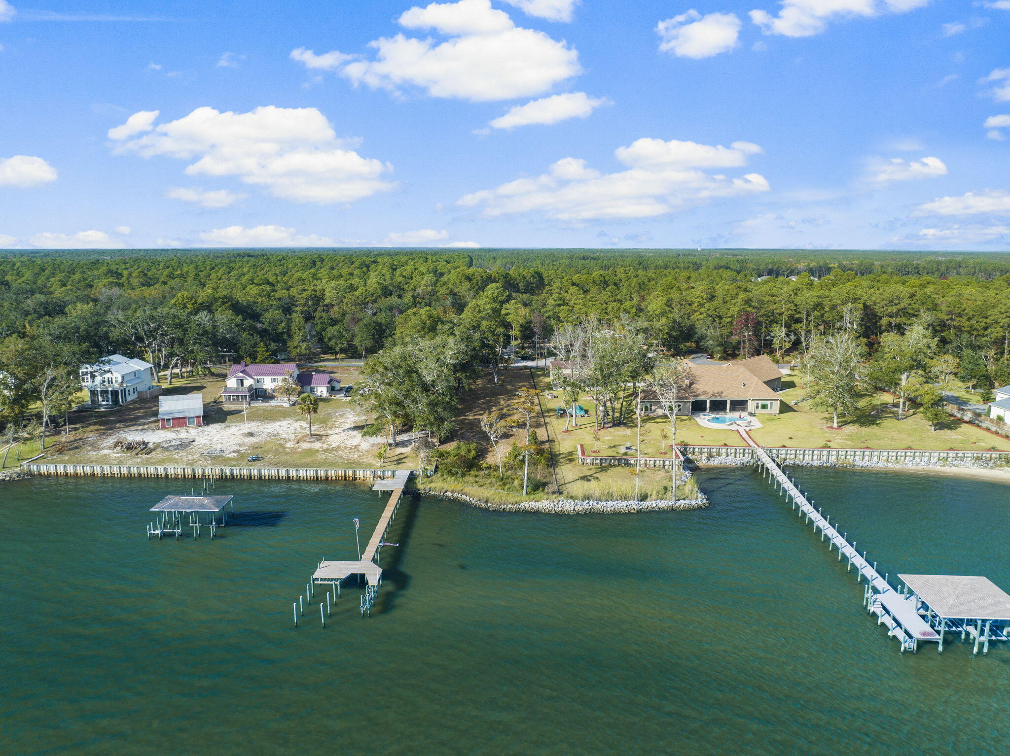 An Outstanding Investment Opportunity: Rare Bayfront Lot in Freeport's Growing Market. As Freeport rapidly expands, opportunities to own bayfront property in a well-maintained neighborhood are becoming increasingly rare. This exceptional half-acre homesite on Red Barn Road offers stunning views of Choctawhatchee Bay and is an ideal investment in one of Florida's fastest-growing cities. Nestled in a meticulously cared-for community with no HOA and located in Flood Zone X, this lot requires no flood insurance. A pre-installed rip-rap wall ensures shoreline stability and enhances the property's aesthetics. Even better, custom plans for a 5,246 sq ft home, specifically designed for this lot, are available to help you bring your waterfront dream to life. Enjoy a quick boat ride to Crab Island or the Intercoastal Waterway, making this an excellent location for relaxation and adventure. With Freeport's continued growth and this rare combination of features, this bayfront lot offers a place to call home and a smart, forward-thinking investment in your future. Survey available upon request.