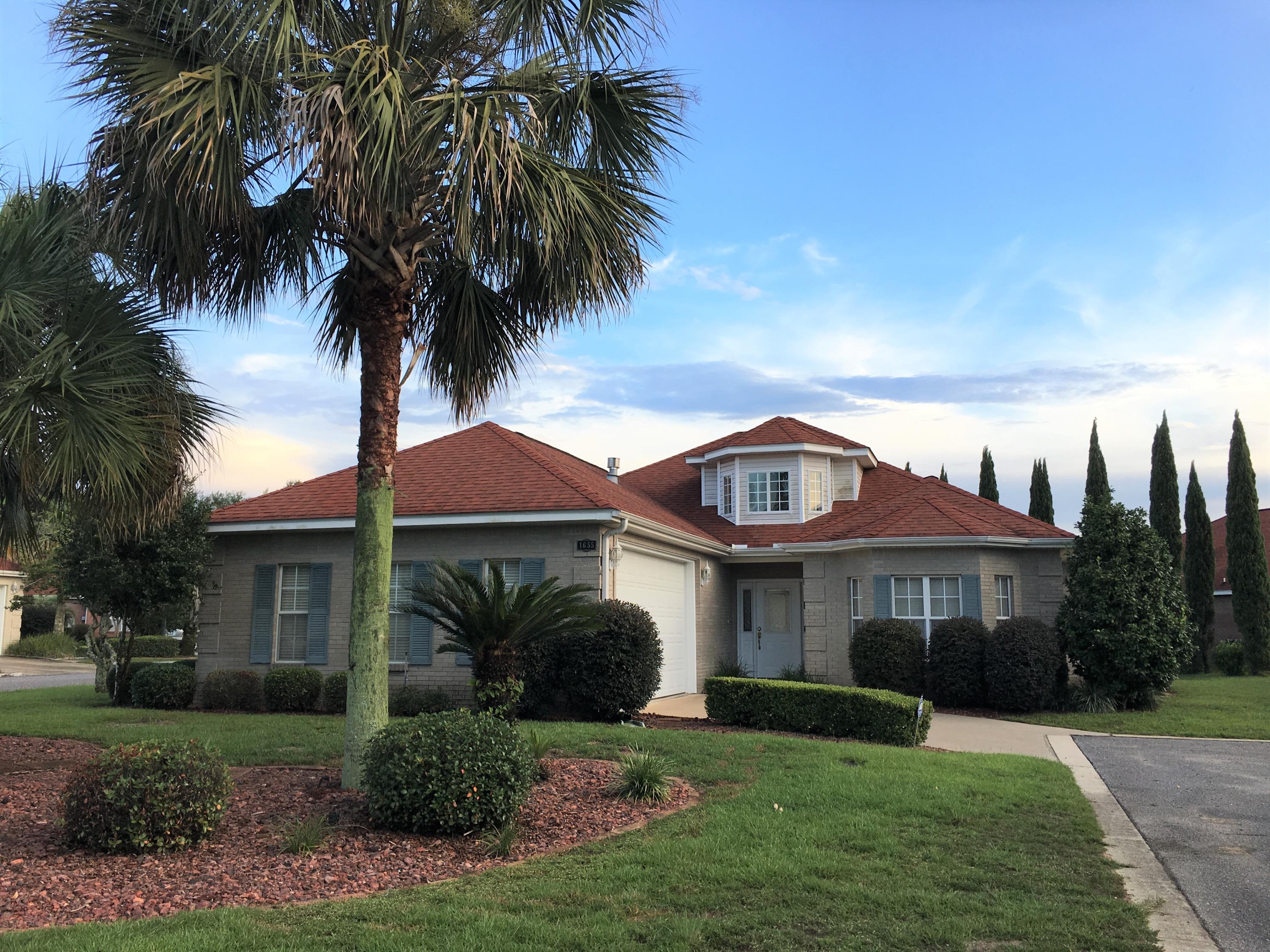 Welcome to this all-brick home in the gated Magnolia Plantation of Bluewater Bay! Beautiful LVP flooring just professionally installed throughout! Vaulted ceilings in the entry foyer lead to the open living space. In the living room you'll find crown moulding, built-ins & niches around the gas fireplace. Spacious kitchen features a breakfast bar, sink overlooking living area, solid surface counters, newer refrigerator, & walk-in pantry. Off of the kitchen is the formal dining room w/crown & trey ceiling. The master suite trey ceiling is an extra touch w/crown that even continues to the ensuite. In the master bath there's 2 vanities, jetted/garden tub, separate shower & walk-in closet! Head out the back French doors to a screened patio-perfect for morning coffee or tea. See this home today!