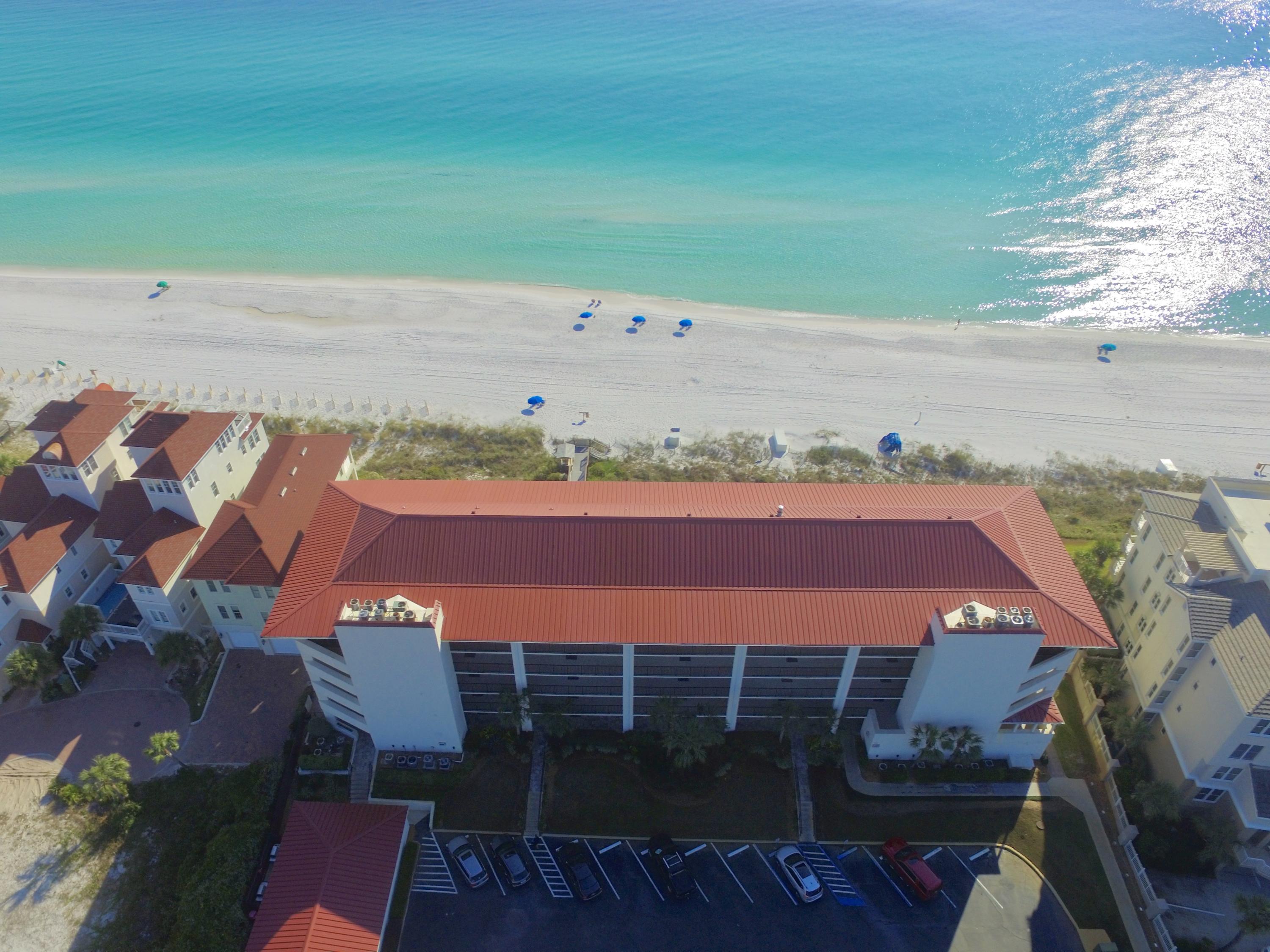 NOW BEING SOLD FURNISHED WITH A FEW EXCEPTIONS - Penthouse with spectacular views and over 200 ft. of direct gulf-frontage in the highly sought after gated complex of Huntington By The Sea. The living & dining areas, master bedroom and the two additional bedrooms all face the gulf and have sliding glass doors that access the balcony. Rarely do these (31 units) even make it on the market before they are snatched up. It is constructed of concrete and steel with hard coat stucco exterior siding and a metal roof. Each condo has its own personal 9x6 storage space. This unit has never been on a rental program. The unit has three new sets of impact resistant glass sliding doors in the main living area of the condo. Over 500 sq. ft. of balcony space. Furnishings included with some exception