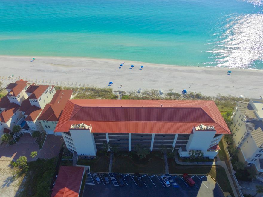 NOW BEING SOLD FURNISHED WITH A FEW EXCEPTIONS - Penthouse with spectacular views and over 200 ft. of direct gulf-frontage in the highly sought after gated complex of Huntington By The Sea. The living & dining areas, master bedroom and the two additional bedrooms all face the gulf and have sliding glass doors that access the balcony. Rarely do these (31 units) even make it on the market before they are snatched up. It is constructed of concrete and steel with hard coat stucco exterior siding and a metal roof. Each condo has its own personal 9x6 storage space. This unit has never been on a rental program. The unit has three new sets of impact resistant glass sliding doors in the main living area of the condo. Over 500 sq. ft. of balcony space. Furnishings included with some exception