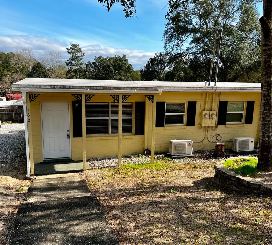 Very tastefully remodeled duplex. Electric and plumbing have been updated. Ceramic tile flooring throughout. Fresh paint. Kitchen has refrigerator, range, dishwasher and nice pantry. Large closet in bathroom. Living room and bedroom have ceiling fans. Unit has been updated with new technology Mitsubishi ENERGY STAR ductless air conditioning and heating system for low electric bill. Inside utility room with washer dryer hookup and plenty of storage. Nice deck on back of unit. Gravel parking area for 2 vehicles. Owner provides lawn service.