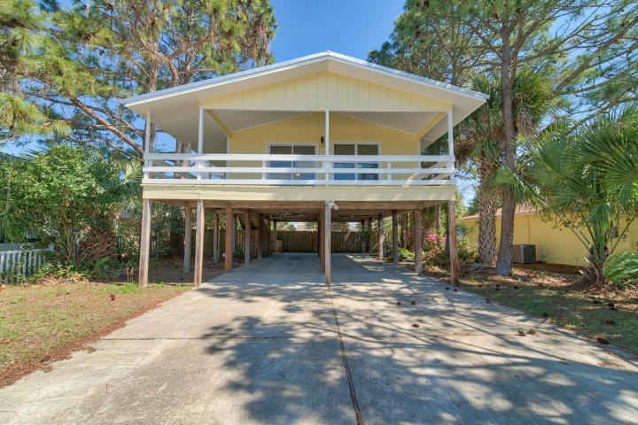 Sweeeeet! Beach cottage only a few blocks from the Grand Lagoon Boat ramp and only a few blocks to the Beach! Great location! This stilt home is fresh,light ,clean and charming. Very Well done upgrade including new stainless steal appliances, new light fixtures, paint and flooring. The balcony is awesome. You can just chill after a day at the beach. This home sits on a large lot that is partially fenced. Lots of covered parking or you can enclose the downstairs for extra living area if you are want. This is a move in ready vacation home or rental property. All it needs is your decorating style to complete the look. Priced right! This will go quickly.
