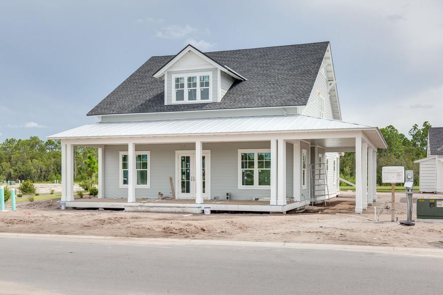 The brand new Laurel floor plan built by Arkon Group is a beautiful, coastal-style home with comfortable living spaces inside and out. The layout features 4 bedrooms including a first floor master suite, 4.5 bathrooms, a 2-car detached garage + carport, a home office, a butler's pantry off the kitchen, and 625 square feet of covered porches. The spectacular outdoor living spaces offer beautiful pond views, screened porch, a private pool, and plenty of space to sunbathe. Luxury features include hand-scraped and wire-brushed oak hardwood flooring, quartz countertops, Bertazzoni Stainless Appliances, tile backsplash, shiplap accent walls, freestanding bathtub in the master, mosaic tiled shower, and more. Estimated completion October 2020.