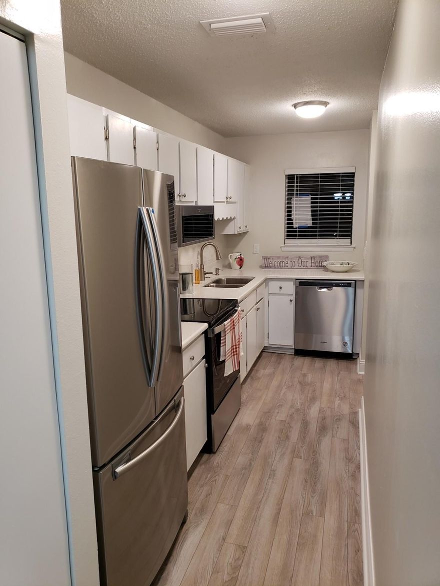 ANOTHER BAY LIVING INC PROJECTCompletely Remodeled Town Home __ New Roof,New Ac--