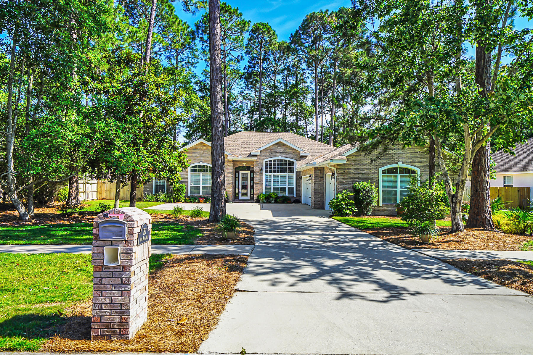 Do not miss this phenomenal 4-bed/2.5-bath home with a massive 3-car garage in Bayshore Place, which has NO HOA and is centrally located in Niceville! The backyard offers a large screened-in patio and a 220V outlet, ready and waiting for a hot tub. This freshly painted custom home has 12ft tall ceilings, plenty of finishing touches and endless amounts of storage. Most rooms have trey ceilings, recessed lighting, crown molding and beautiful archways. The foyer is grand with an office/bedroom and formal dining room flanking the entryway. Walk through the foyer into the living room with a gas fireplace that is overlooking the back patio. This master suite has ample space for oversized furniture and has its own door to the backyard. The master bathroom offers a soaking tub, walk-in shower...