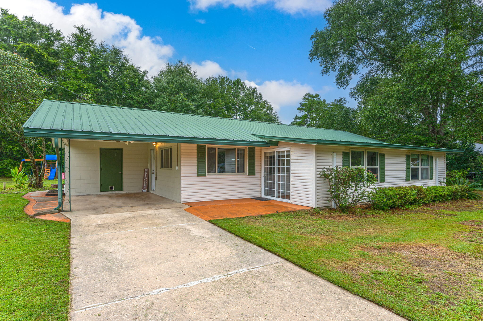 Looking for a move in ready home located central in town? - this one has it all! Home sits on a large fenced irrigated yard with all the extras outside! Home was originally a 3-bedroom converted to a 2 bedroom and has tons of opportunity to make this a great home for your family size! Home has a large open kitchen with tons of cabinets with tile backsplash, all appliances included, and is open to a eat in dining room. The living room also connects to a large bonus room perfect for entertaining. The master suite offers a great master bath that is tile shower and an additional bedroom that could allow 2 bedrooms for your children of as a home office off bedroom. The home has a covered carport, large workshop, additional covered carport and shed all wired. See this one today - move in ready!