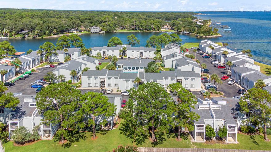 Piece of Paradise,  FINISTERRA is located on Choctawhatchee Bay & Lake Clyde across the street from TWO GEORGES MARINA.  This gated waterfront community enjoys paddle boarding, swimming pool, lighted tennis court, sauna, onsite laundry facilities & clubhouse.  Just minutes to Hurlburt AFB & Eglin AFB with VA approved financing.  The complex includes assigned parking, guest parking & car washing stations. The balcony