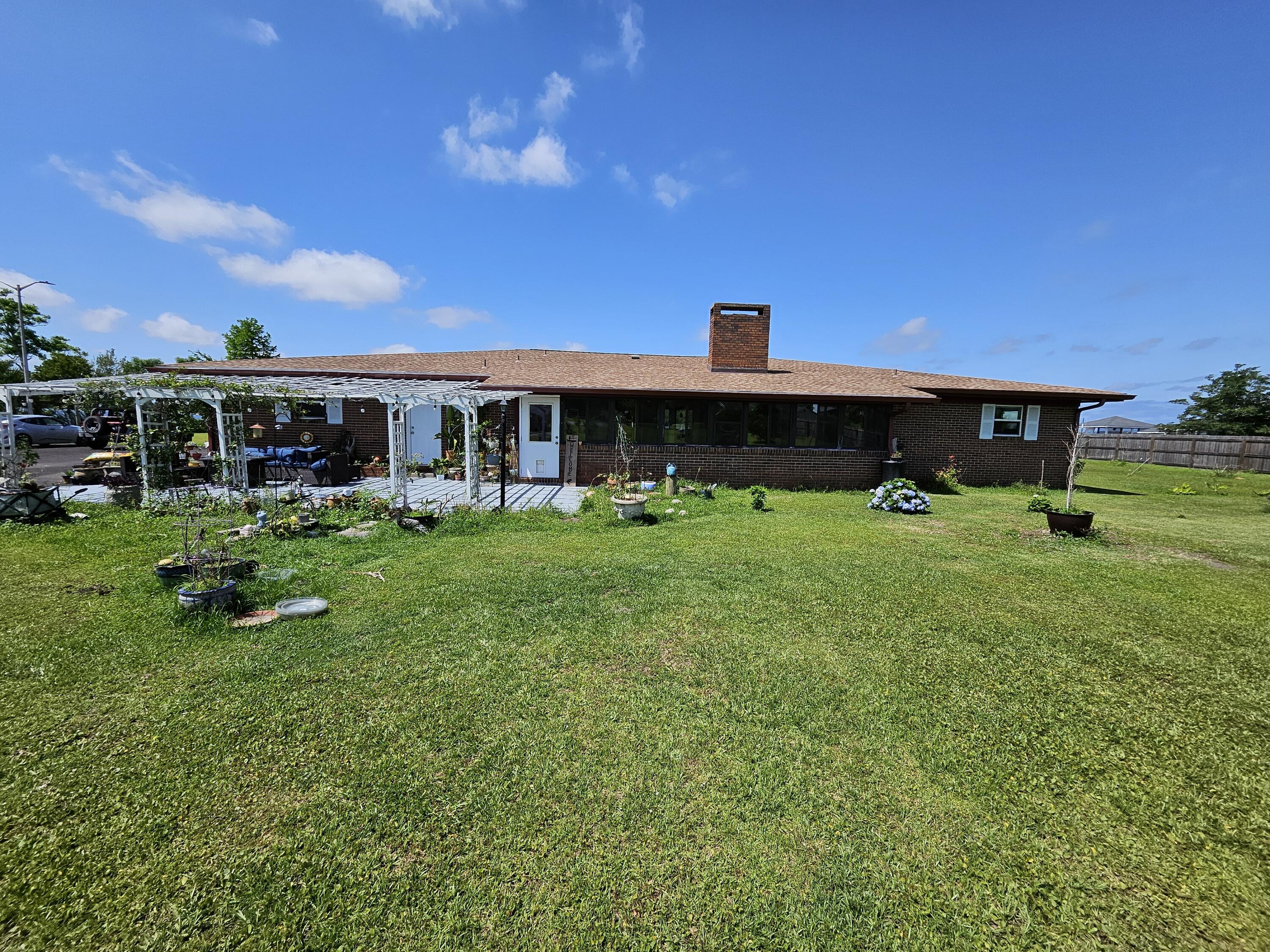 LARGEST SINGLE-FAMILY HOME LOT ON DEER POINT LAKE, BOASTING 1.65 ACRES. This Exceptional Waterfront Retreat on Deerpoint Lake is 4BR/2.5BA. A home like no other surrounded by Deerpoint Lake on three sides with over 700+/- feet of pristine shoreline, this rare and remarkable property offers unparalleled tranquility and access to the water. Situated on a 1.65-acre peninsula in one of the most desirable locations on Deer point Lake, this property is perfect for those seeking privacy, space, and breathtaking views. Originally built in 1969, this spacious 4-bedroom, 2.5-bath ranch-style home underwent a complete renovation in 2013, combining classic charm with modern updates. From its double-pane windows to the enclosed patio and covered front porch, every detail was designed for comfort, efficiency, and year-round enjoyment. Inside, you'll find a bright and inviting floor plan that flows effortlessly, ideal for entertaining or simply relaxing while taking in the natural beauty that surrounds you. The home's orientation provides panoramic water views from multiple rooms, making every day feel like a getaway. Additional features include: Detached garage for additional vehicles or workshop space or it could be a separate boat garage perfect for water enthusiasts. Private boat ramp for easy lake access. No HOA fees offering total freedom and flexibility. Whether you're looking for a full-time residence, a peaceful vacation escape, or a lakeside property with incredible potential, this one-of-a-kind home delivers.