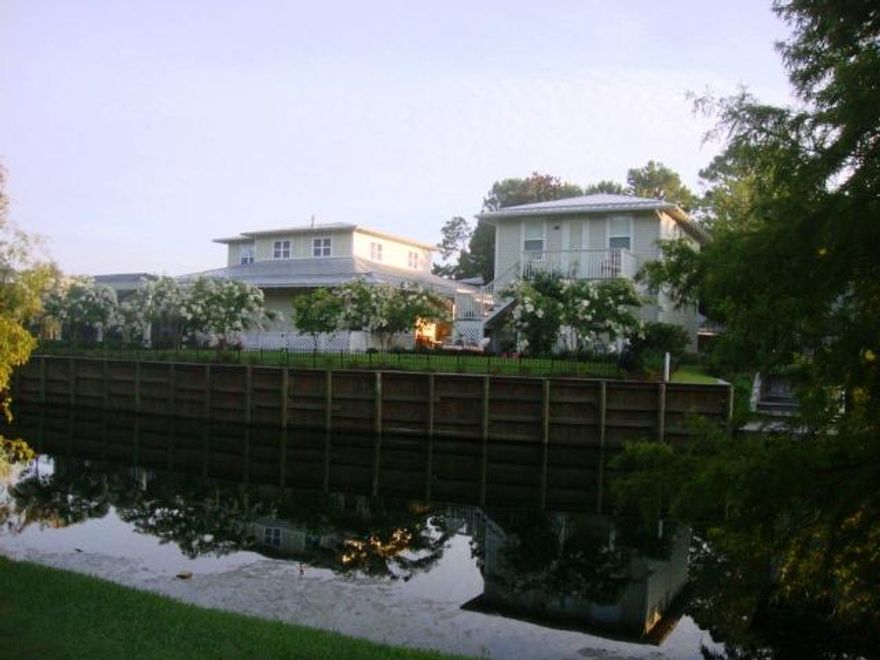 ONE OF A KIND! A hidden gem in the much sought after neighborhood of Prestwick on the Sandestin Beach and Golf Resort. You must see this 4 bedroom/4 bath home to appreciate the major renovation undertaken by the current owners. Hardwood floors are installed throughout the house including the carriage house. A Sea Wall was built on the lake and a beautiful fenced in backyard was created with fruit trees and flowers. The view on the 18th hole of Baytowne is breathtaking during the day as well as at night with stunning sunsets; see picture taken from the pool deck. The separate apartment above the two car garage is ideal for overflow of family and friends. The house is PERFECT for both entertaining or enjoying the peacefulness of one's home. Buyers to verify all dimensions