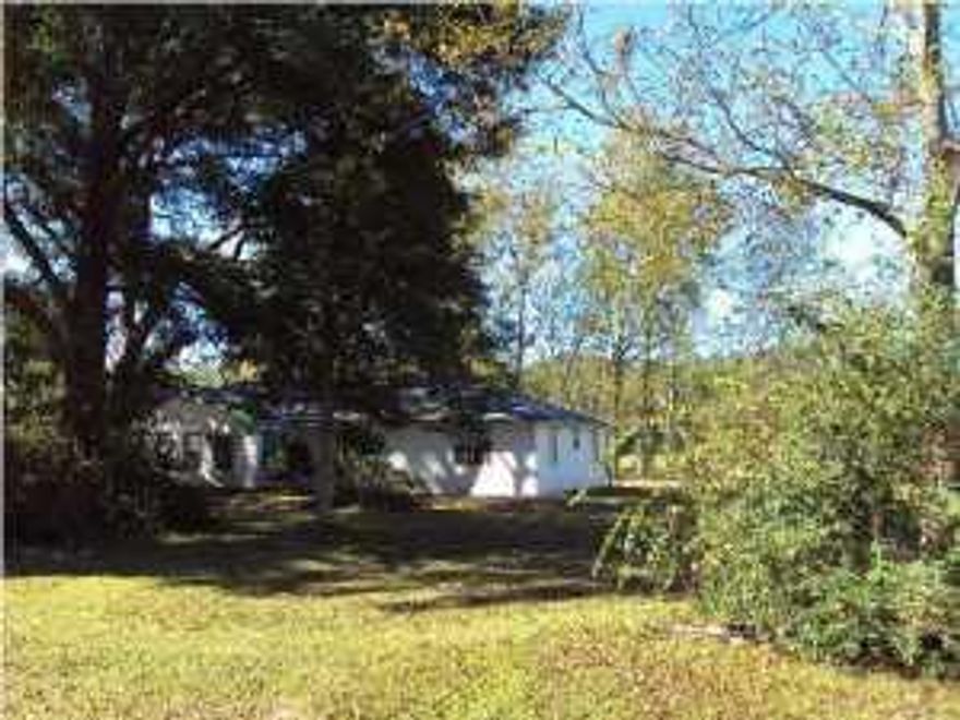 This home has been renovated. The property has 5.22 acres and fronts two paved roads. This may or may not be the correct acrage and Buyer should confirm The covered building could be used as a garage or storage. The HVAC is 6 years old along with the Gen-Air stove with separate oven with a warmer. The master bath has black marble flooring & a large 6 foot grey marble shower & tub. The commode is in a separate room and large walk in closet with custom shelving.The kitchen has an island with wood flooring. The property has beautiful trees with four pastures with four large stalls and auto waterers. A large concrete insulated shed. A piece of heaven. Property holds agriculture exemptions for owner. 10 acres next door also for sale. (4836 Galliver) Property has room for building barns